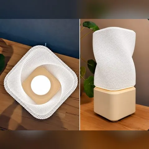 Lámpara geométrica de forma retorcida impresa en 3D, vista desde arriba encendida y de costado